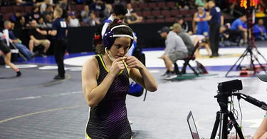 Shocked to qualify to the CIF state tournament in her first season of wrestling, Bell High freshman Luiza Nogueria knew the coaches believed in her - Tri-Titans
